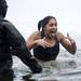 A Ford Lake Frozen Leap participant makes her way out of the cold water on Saturday, Feb. 16. Daniel Brenner I AnnArbor.com